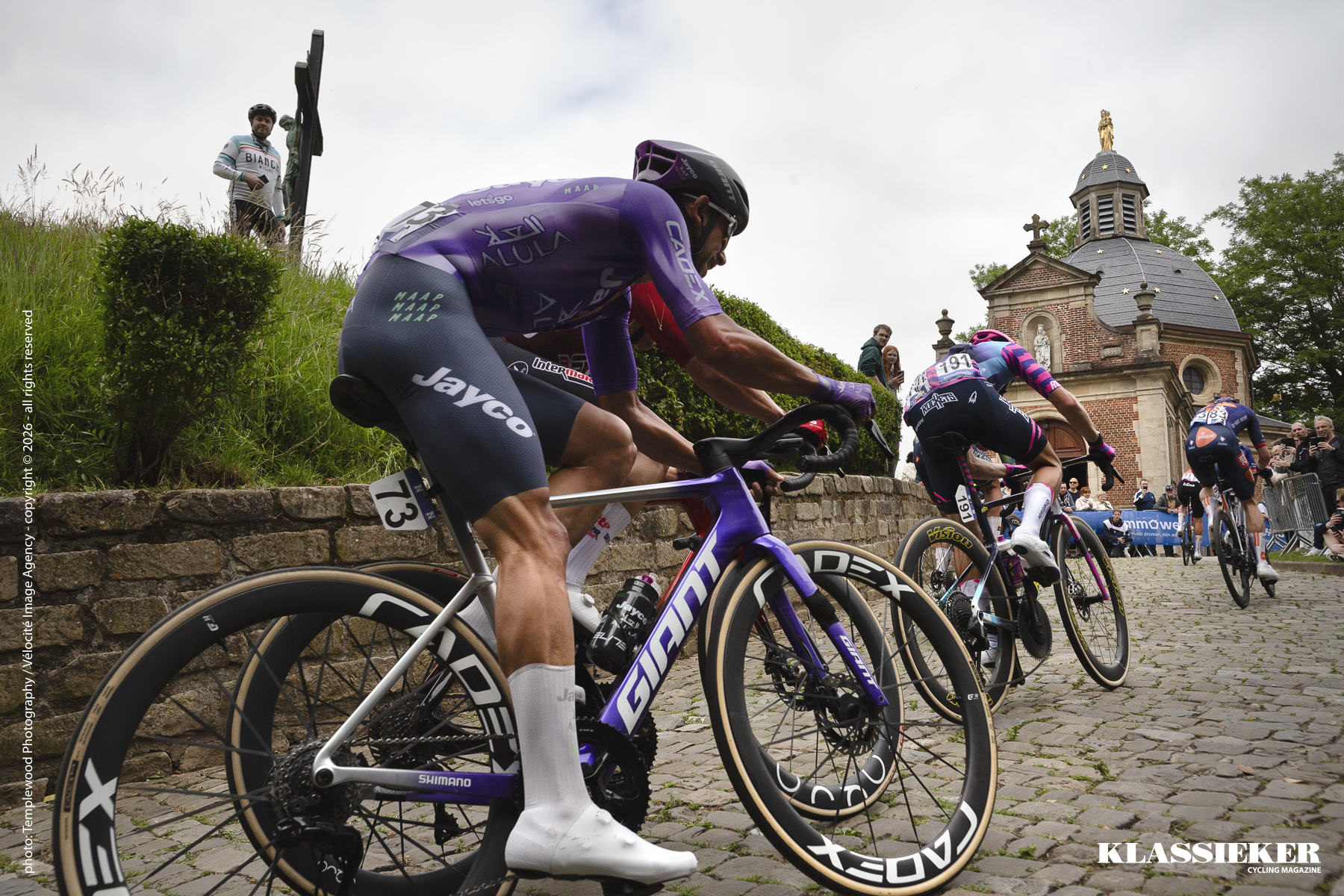 Riders tackle the Murr van Gerrardsbergen. The Muur is one of the iconic climbs of Belgian cycling with the chapel at its summit
