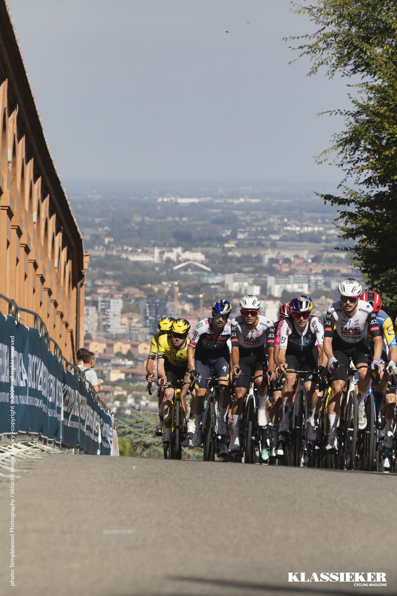 Giro dell’Emilia 2025 - A group of favourites climbs past the terracotta coloured portico on the San Luca climb