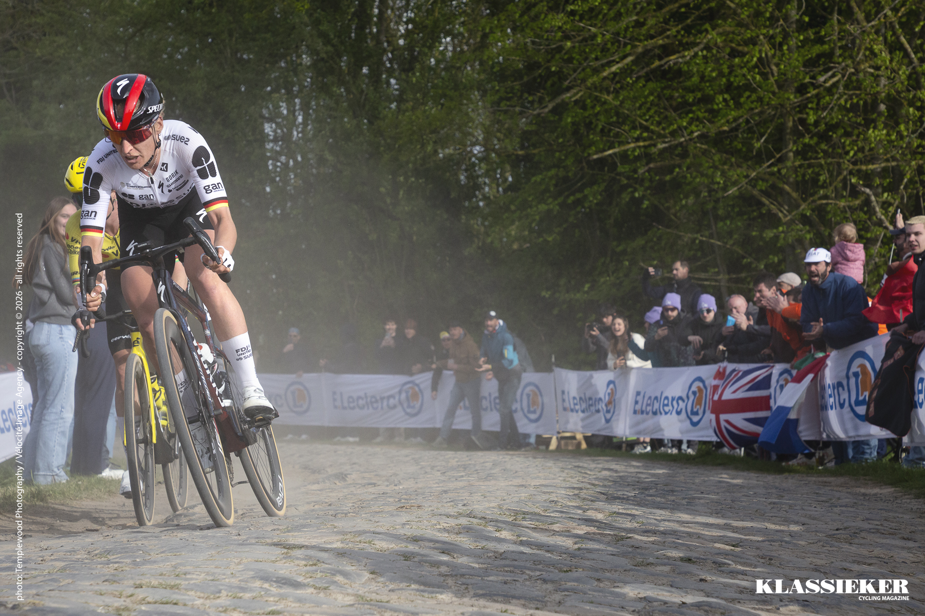 Franziska Koch in her German champion’s jersey rounds a corner on the Carrefour de l’Arbre cobbled sector.  She would go on to win the race.